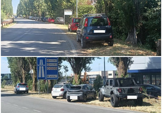 Le auto in sosta sulle banchine di via De Gasperi