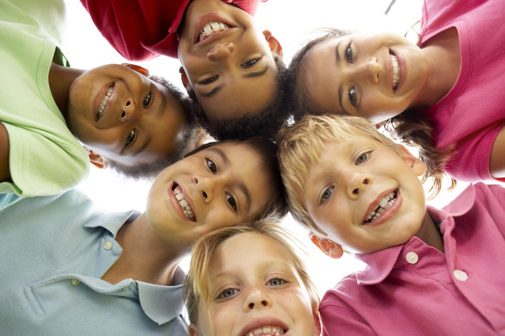 Group Of Children Playing In Park
